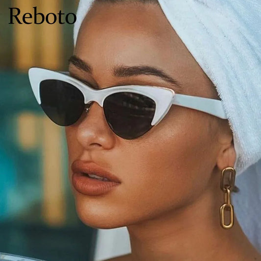 White cat-eye sunglasses with dark lenses and slim temples