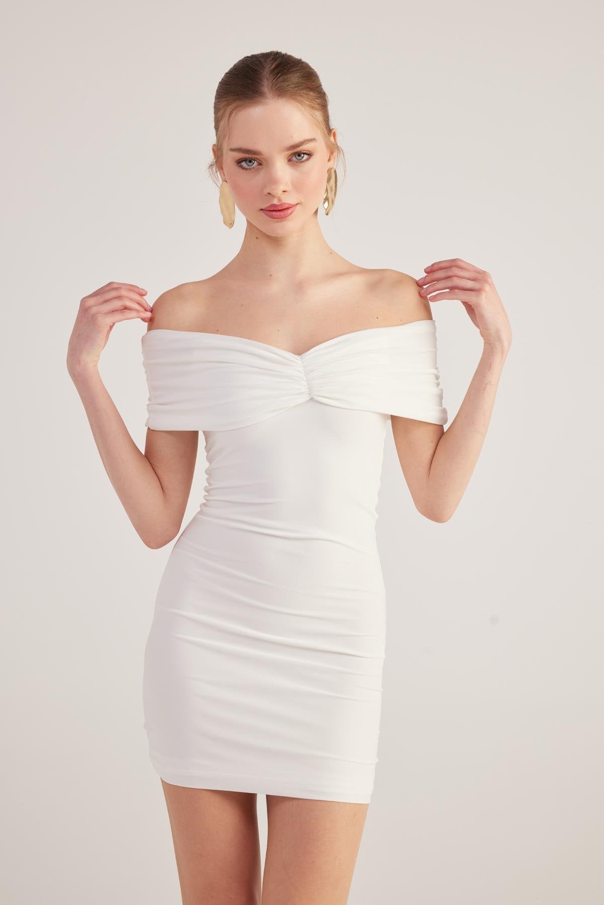 White off-shoulder mini dress with sweetheart twist front and ruched fitted waist