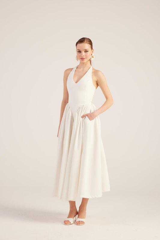 White sleeveless V-neck maxi dress with gathered waist and full pleated skirt