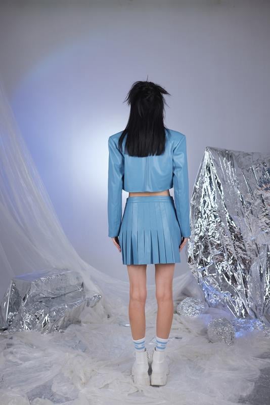 Blue faux leather cropped jacket, back view showing waist-length cut