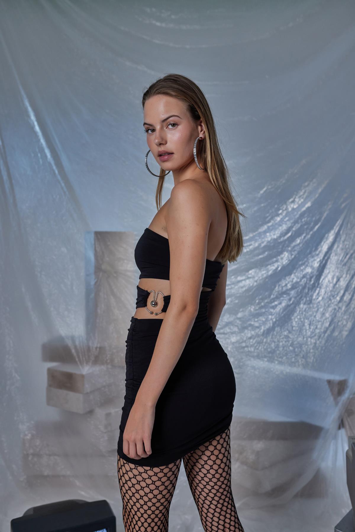 Black strapless mini bodycon dress with front waist cutout and side ruching