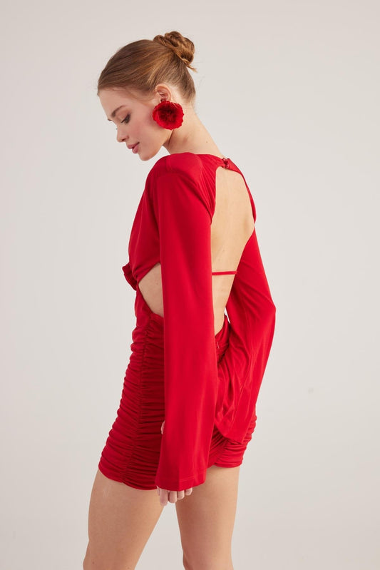 Red backless long-sleeve mini dress with ruched front, open back, red rose accessory