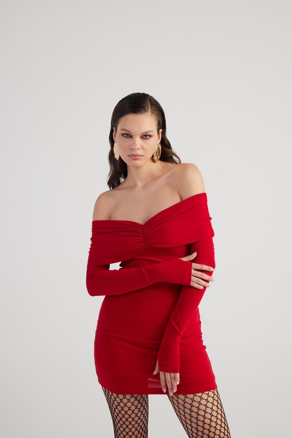 Red bardot mini dress detail: gathered ruched off-shoulder bodice