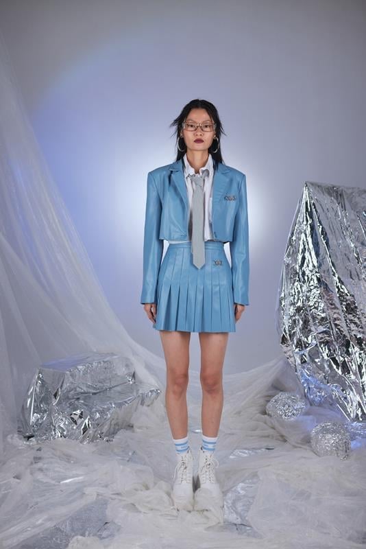 Blue faux leather cropped jacket with long sleeves and waist-length cut