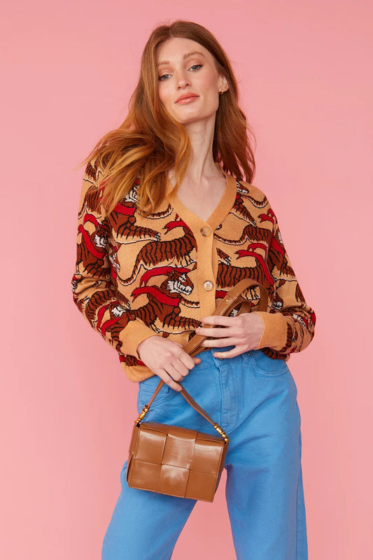 Brown eco leather mini bag with gold chain strap, shown at front