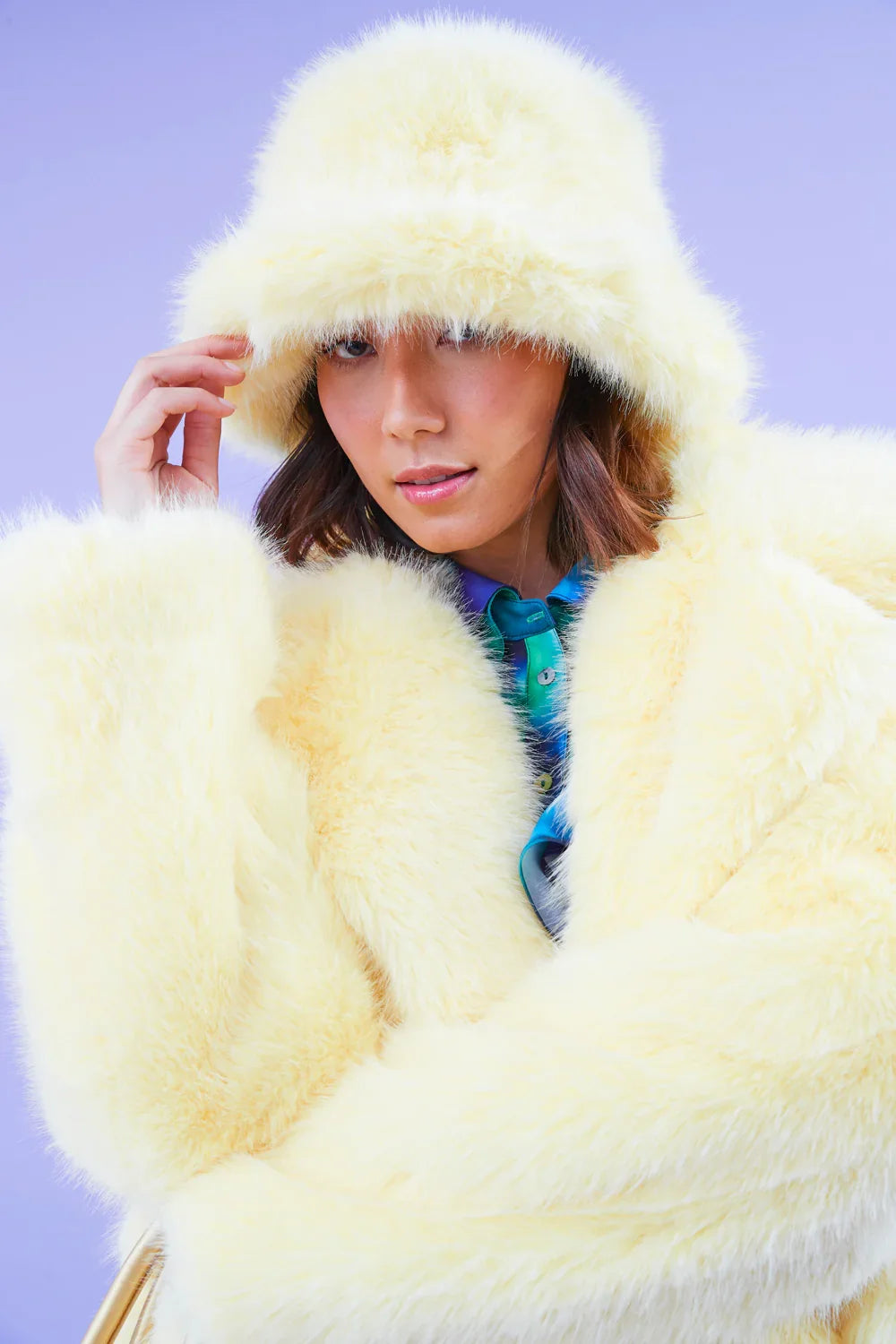 Yellow faux fur bucket hat with soft wide brim, rounded crown