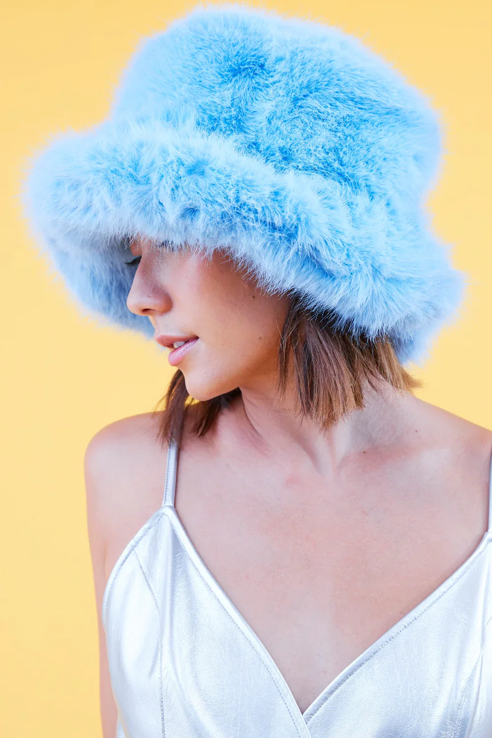 Light blue faux fur bucket hat with short wide brim, fluffy texture