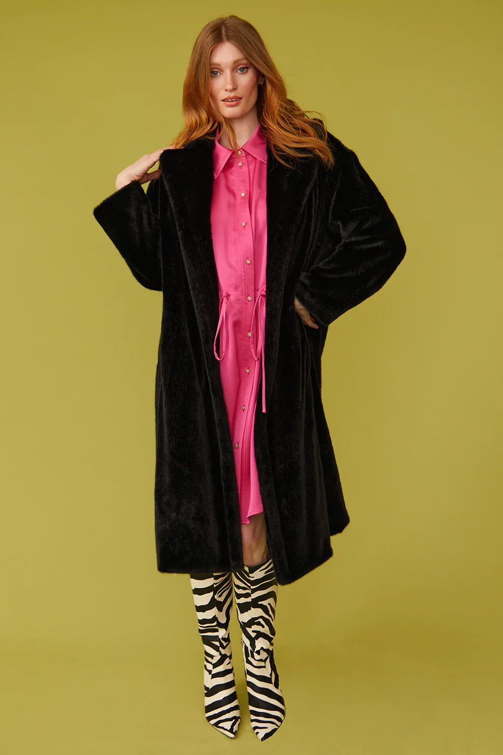 Black faux fur maxi coat with draped fit, long sleeves, and open front