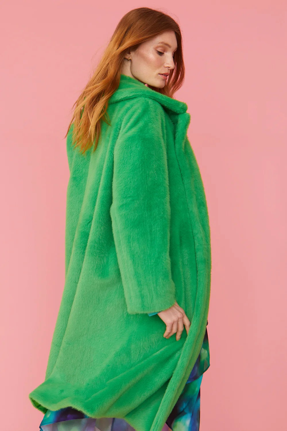 Green faux fur maxi coat, side view with draped hood and long hem