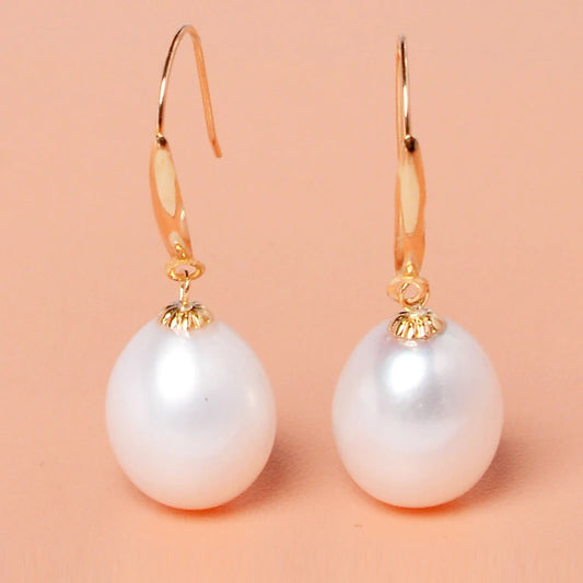 Gold-tone drop earrings with large natural white freshwater pearl