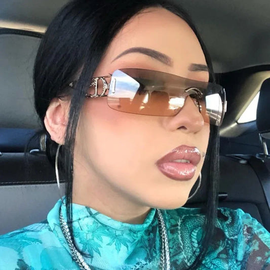 Rimless fashion sunglasses with mirrored amber lenses and silver cutout temples