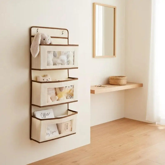 Hanging bed storage organizer bag with clear window pockets, brown trim, wall hook style