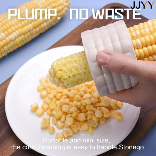 White ridged corn peeler tool scraping kernels onto a plate