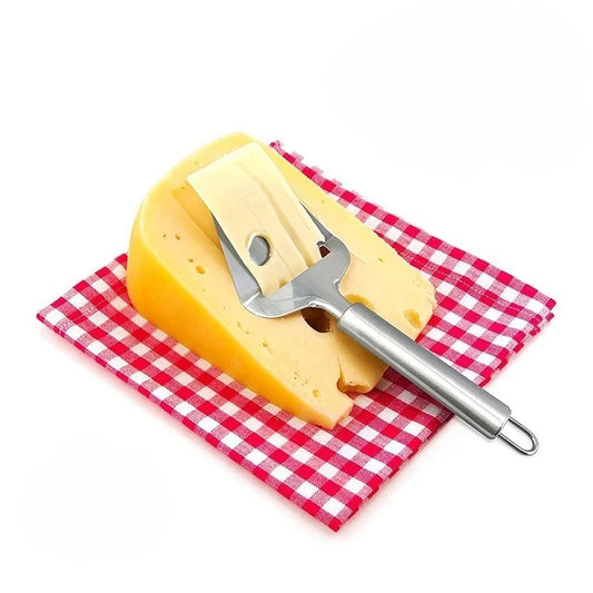 Handheld cheese slicer with metal blade and cylindrical grip on yellow cheese
