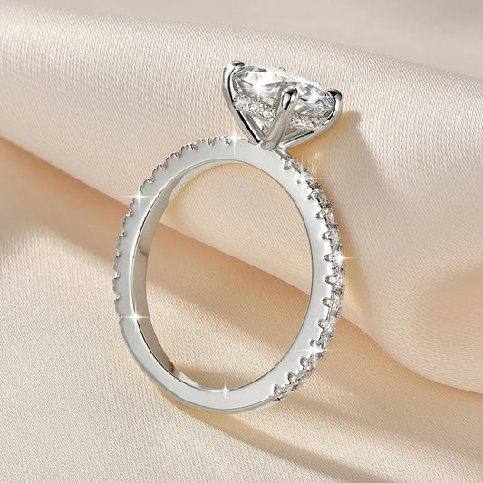Sterling-silver moissanite ring with round center stone and halo of small stones