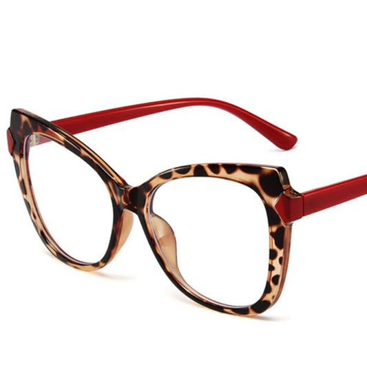 Oversized cat-eye reading glasses, tortoise leopard front with red arms and clear lenses