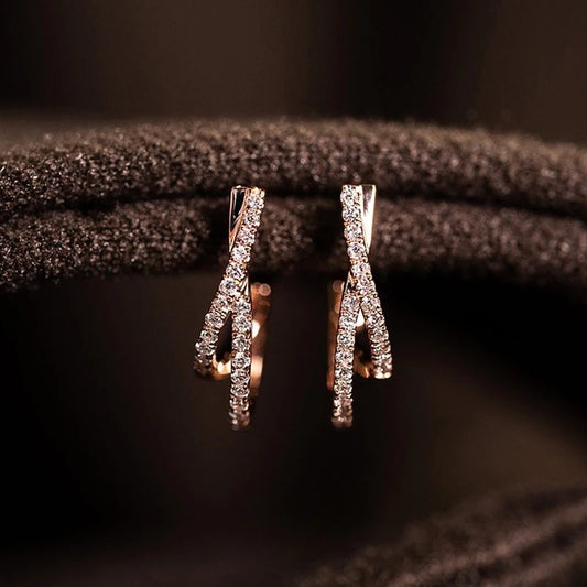 Pair of rose gold tone CZ cross hoop earrings, dangling teardrop crystal details
