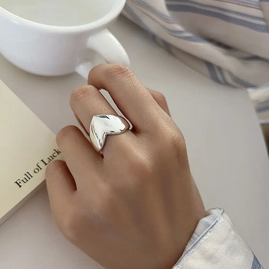 925 sterling silver heart-shaped statement ring with mirrored finish on finger
