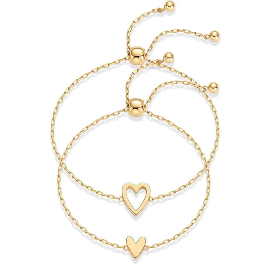 Gold-tone heart charm bracelet set with two heart solitaire charms, adjustable chain links