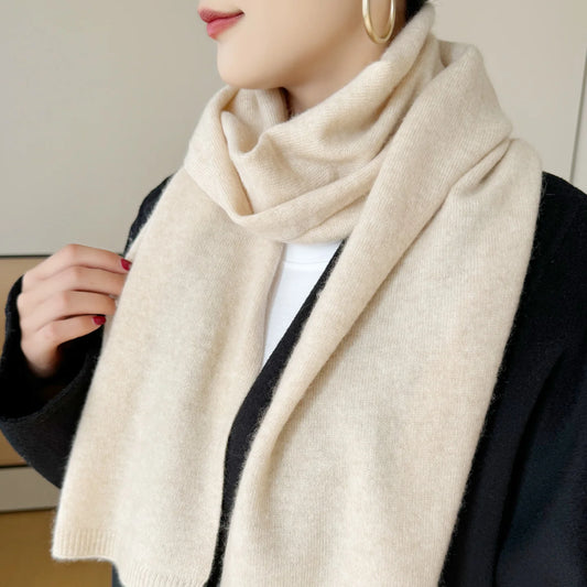 Women's beige cashmere knit scarf, draped around the neck with soft knit texture