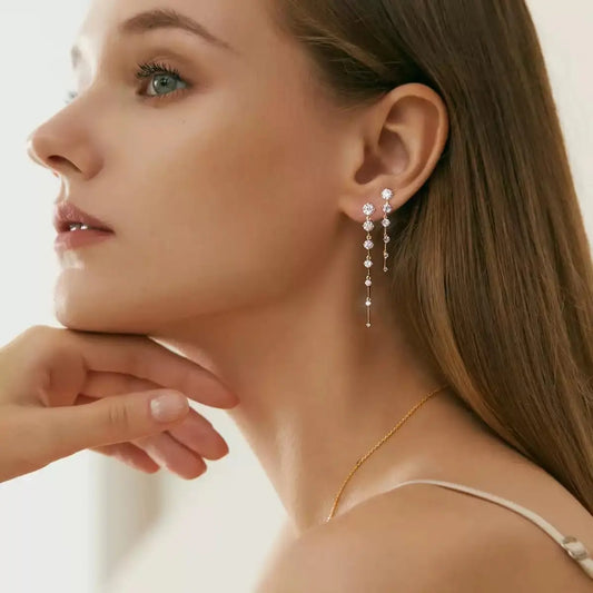 Gold-plated long dangle earrings with rows of round CZ stones