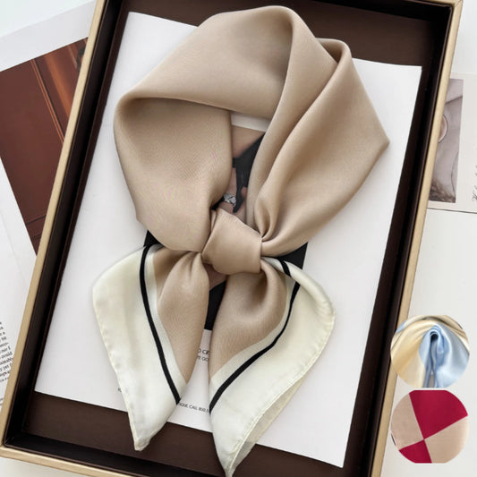 Beige square scarf with black edge trim, neatly tied in a knot