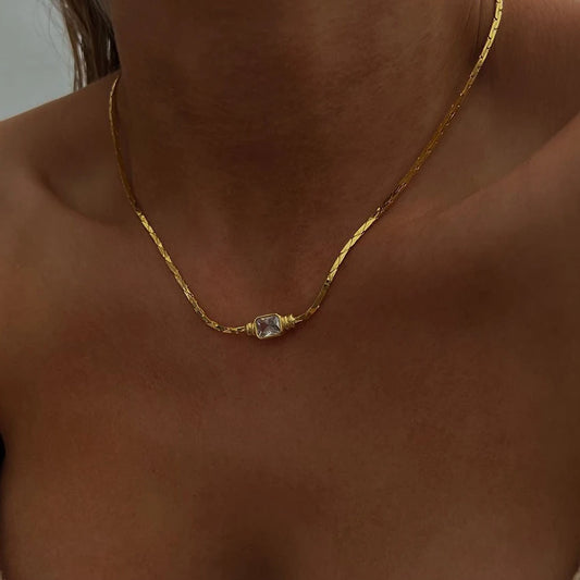 Gold chain necklace with small square crystal pendant