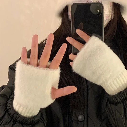 White fuzzy fingerless half gloves with ribbed knit cuffs for warm wrist coverage