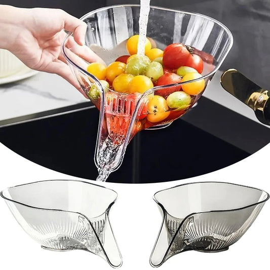 Transparent drain basket strainer bowl with fruit and vegetables being rinsed under water