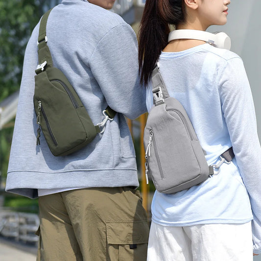 Olive chest sling bag with zip front pocket and adjustable shoulder strap