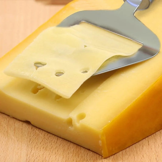 Stainless steel handheld cheese slicer with flat blade over cheese wedges