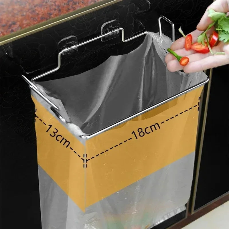 Door-mounted stainless trash bag holder rack with gray liner and metal hooks