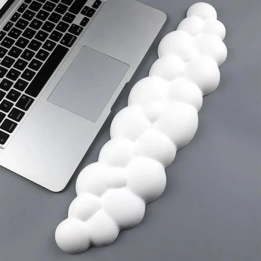 White cloud-shaped wrist rest pad with cushioned bubbled design for mouse