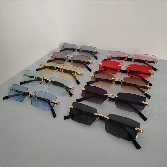 Set of rimless sunglasses with mixed dark lenses and gold-tone metal frames