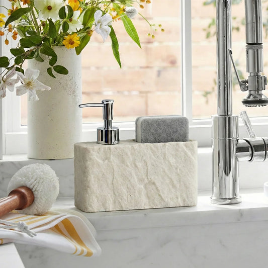 Beige stone-texture soap dispenser with chrome pump and gray sponge holder caddy