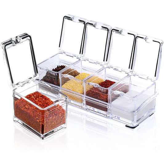 4-compartment transparent spice box with multiple hinged lids open, filled with assorted seasonings