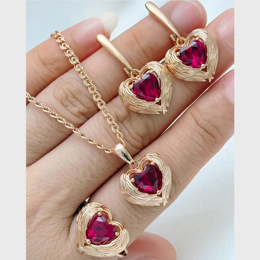 Rose gold heart-shaped gemstone jewelry set with necklace chain, ring, and drop earrings