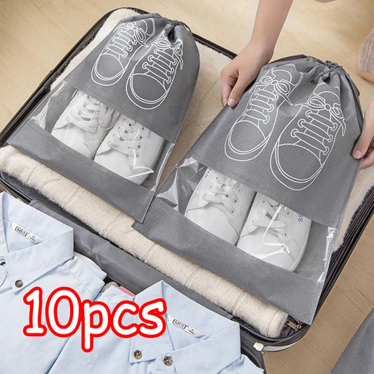 Gray non-woven shoe storage drawstring bag set with white sneaker graphics and clear pockets