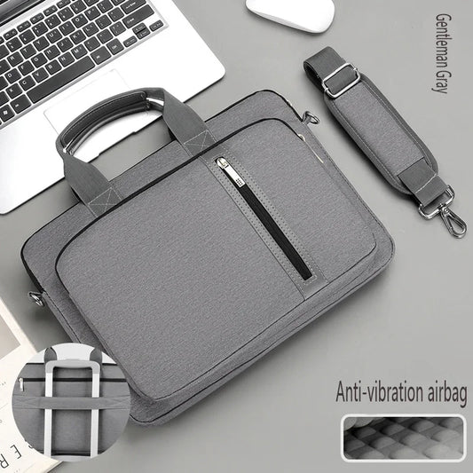Gray laptop sleeve bag with front zipper pocket and crossbody strap