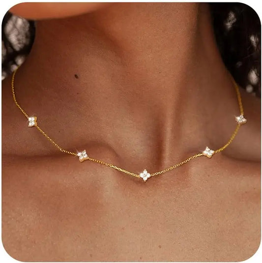 Gold-plated choker necklace with five clover-like cubic zirconia charms on a chain