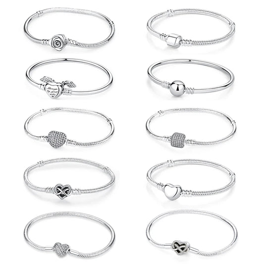 Silver-tone charm bracelet set with heart, bead, heart-lock, and snake clasp charms