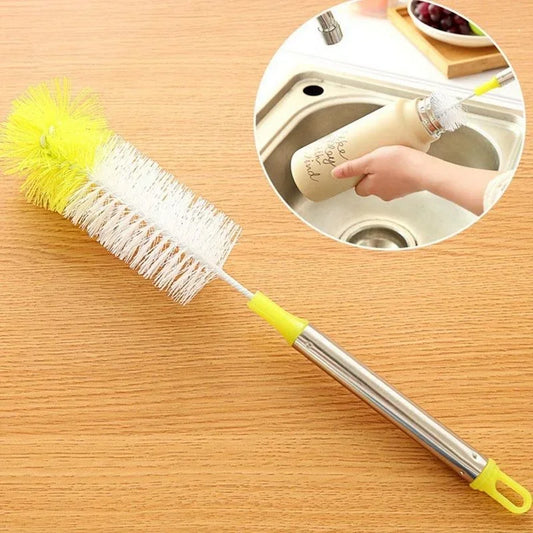 Bottle cleaning brush with round head, white bristles, and green/yellow handle.