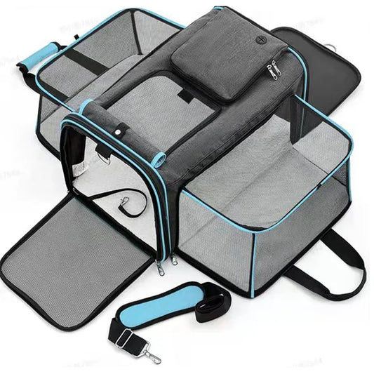 Foldable gray pet carrier with breathable mesh panels, multiple compartments, and blue trim