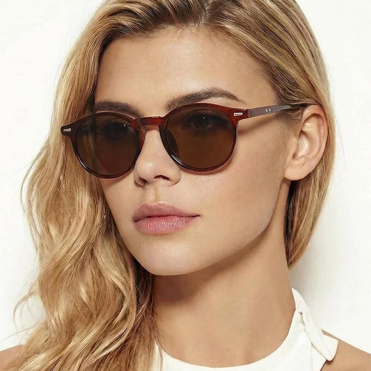 Round vintage sunglasses with dark brown lenses and burgundy frame
