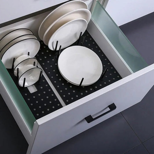 Kitchen drawer pegboard rack with black base and upright dish plate holders