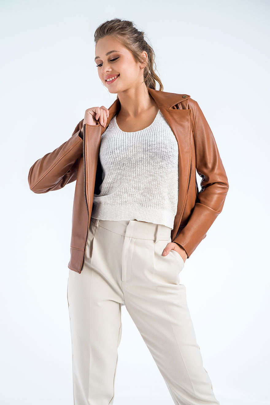 Chocolate brown leather jacket with zip front, zip cuff detail, worn over light top