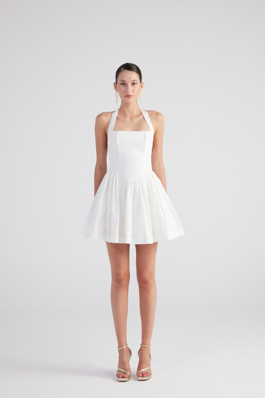 White pleated mini dress with square neckline and bow accent at the straps