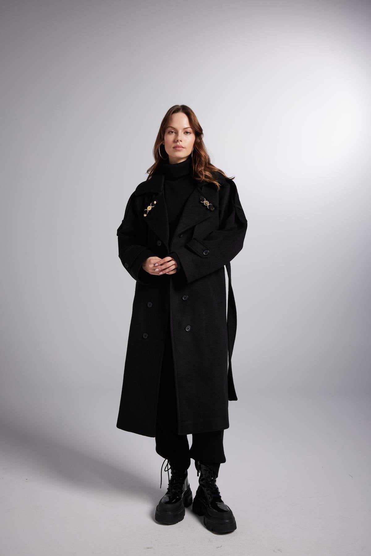 Black belted maxi wool coat with gold-tone buttons and shoulder accents
