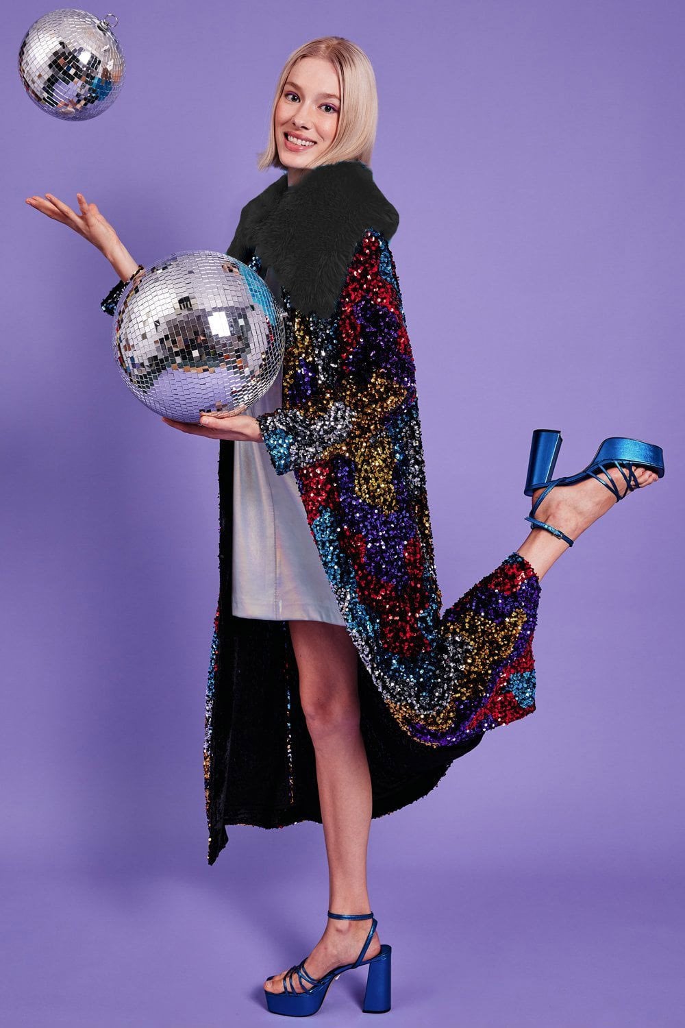 Black sequin velvet trench coat with dark faux fur collar, open front
