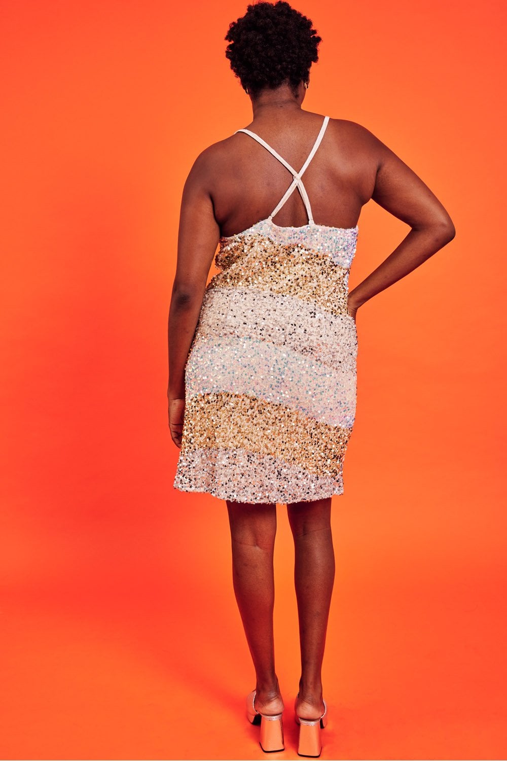 Champagne gold sequin slip dress with crisscross spaghetti-back straps and open back
